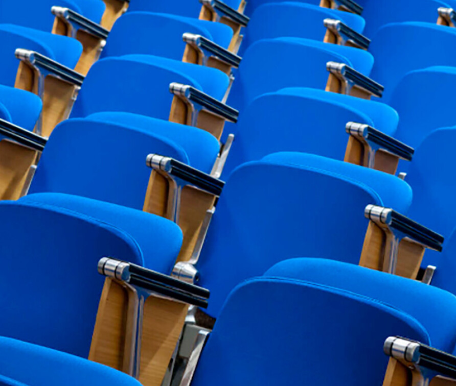 blue seats in lecture theatre
